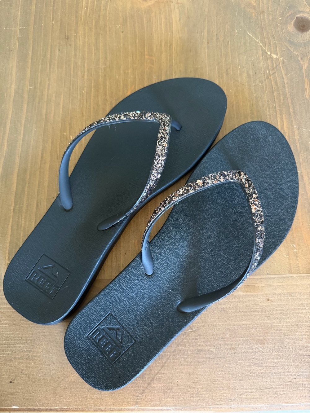 Reef Women's Black Flip Flops with Gold Glitter Straps